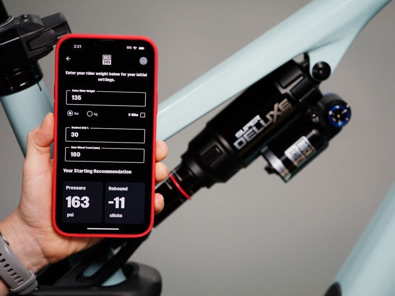 RockShox TrailHead app showing starting air pressure and rebound next to a Super Deluxe rear shock