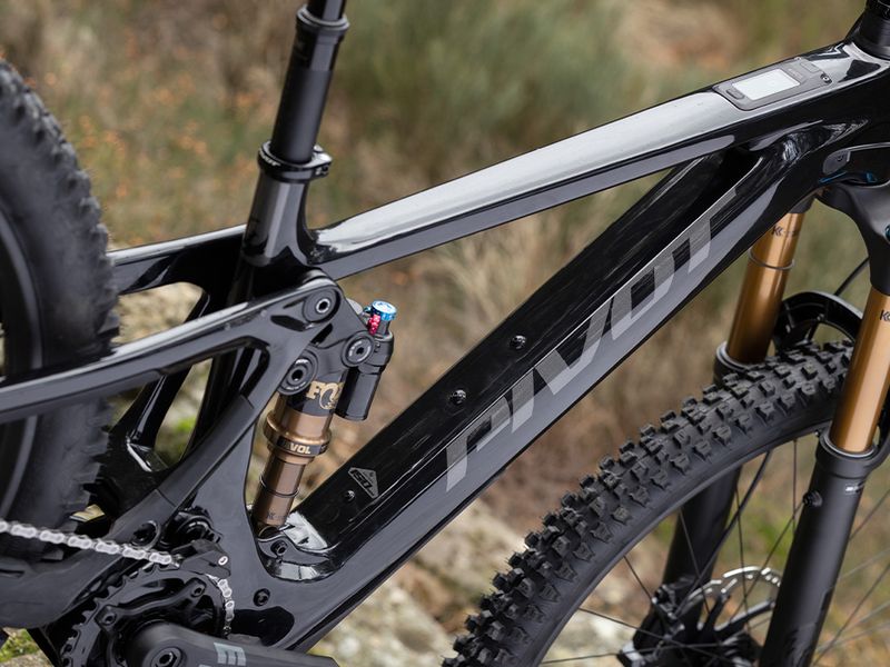 Pivot Shuttle AMP'd Team XX Eagle Transmission e-MTB, riding shot 2