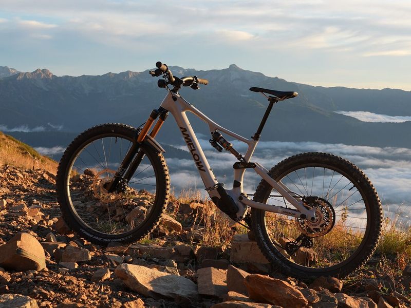 Amflow PX Pro eMTB with Avinox M2S motor on a mountain ridge above the clouds