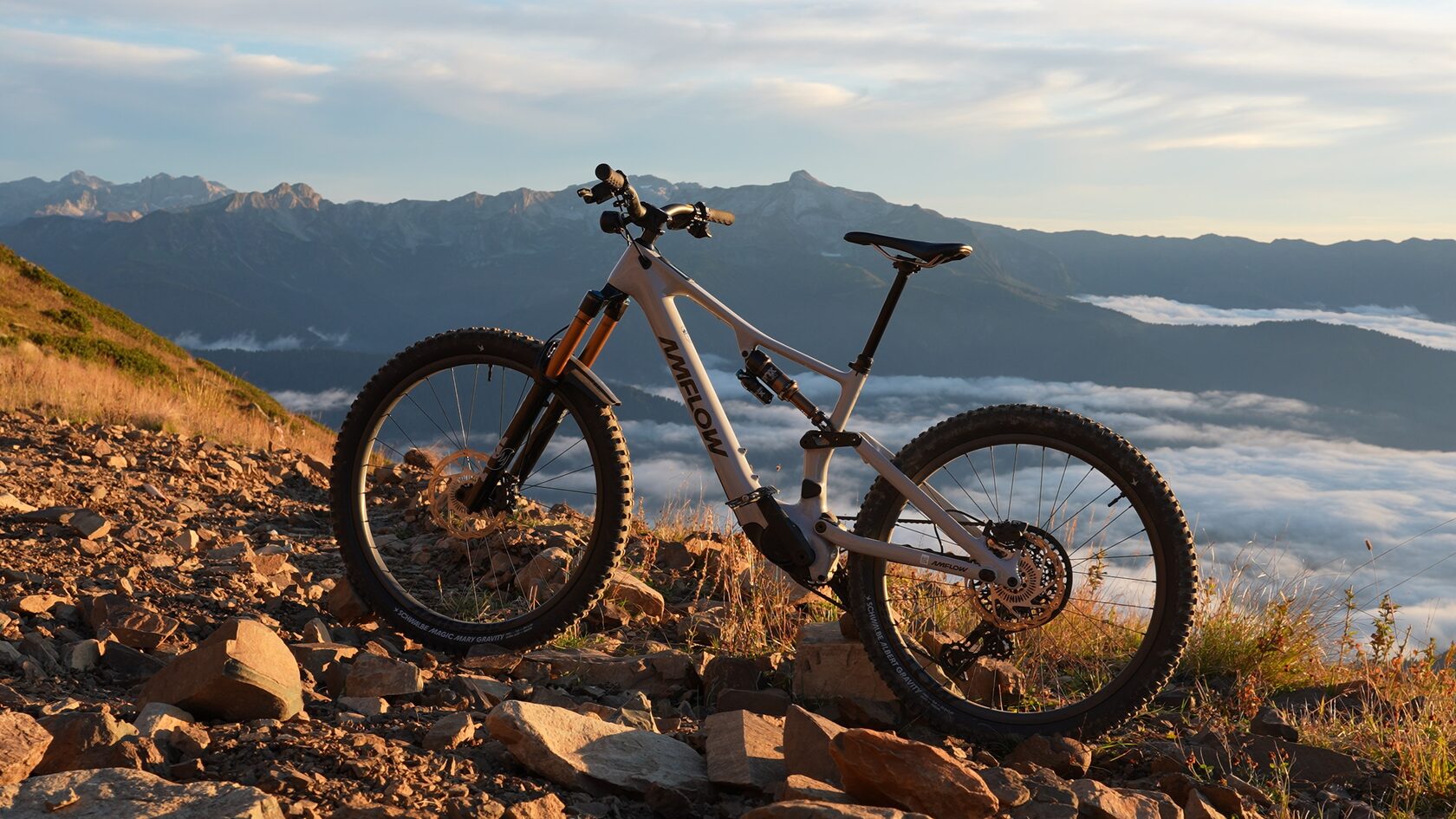 Amflow PX Pro eMTB with Avinox M2S motor on a mountain ridge above the clouds
