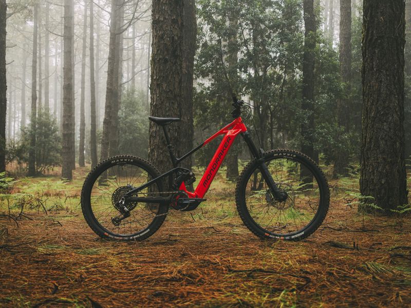 Red Mondraker Level R e-MTB in a pine forest