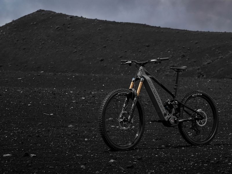 Mondraker Level RR e-MTB on a dark volcanic slope