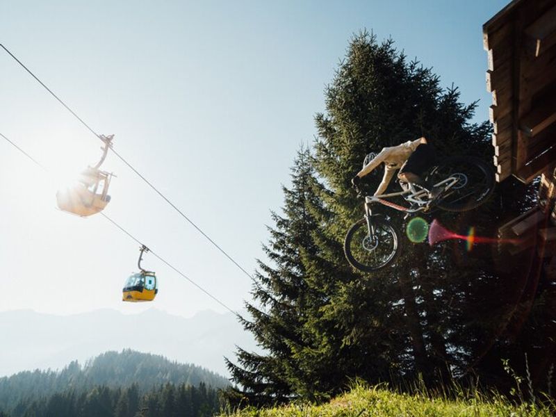 Mountain biker in mid-air on the Hill Bill line in Serfaus-Fiss-Ladis